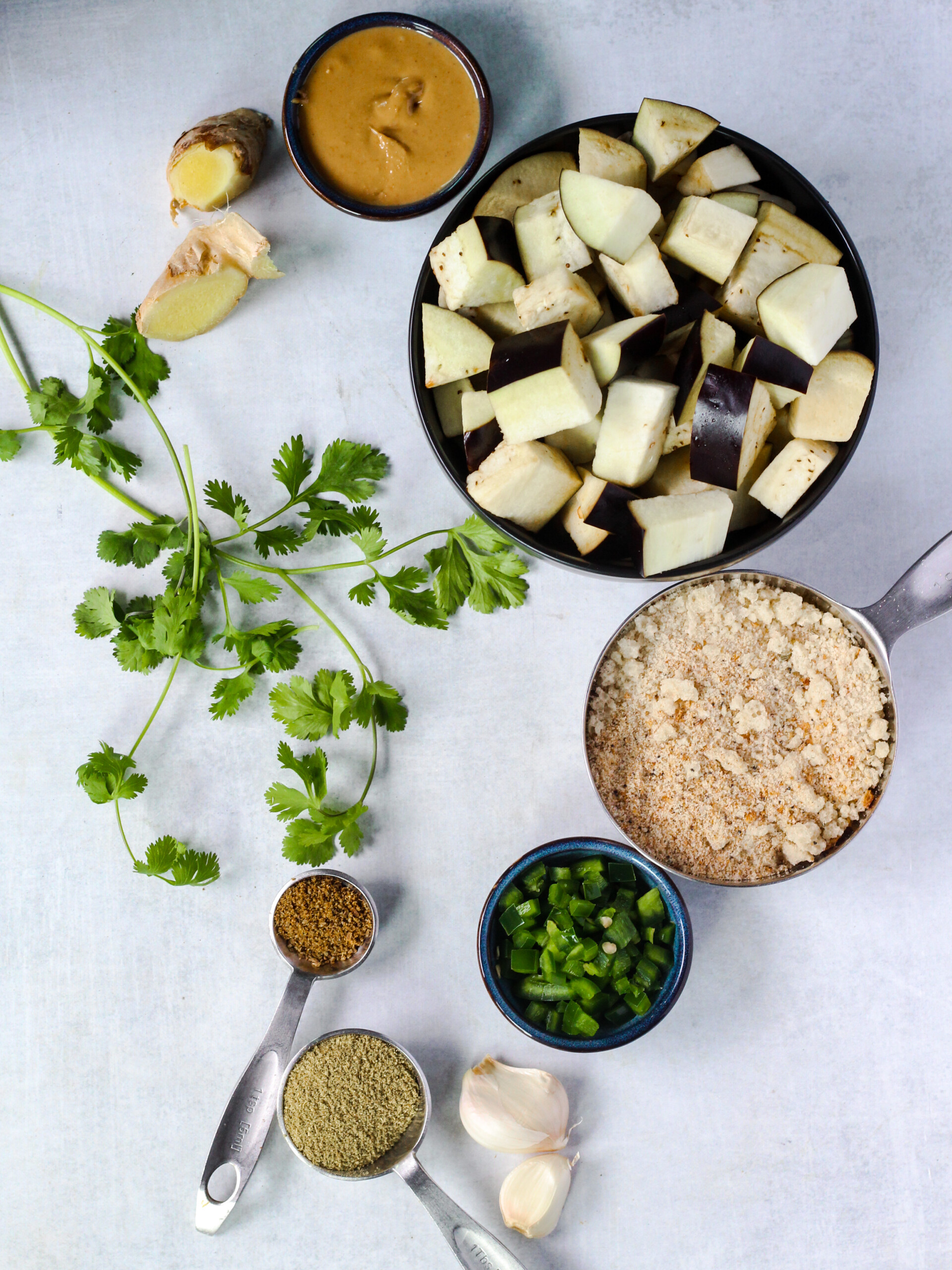 ingredients: eggplant, gingerl garlic, breadcrumbs, jalapeno, cashew butter, cilantro, cumin, coriander